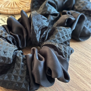 Luxurious black satin hair scrunchie with diamond texture and high elasticity