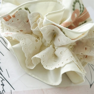 Elegant ivory lace scrunchie with pink ribbon and leaf embroidery, 2025 spring collection