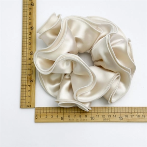 Elegant large cream satin scrunchie with ruffled edges, 15cm diameter hair accessory