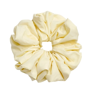 Elegant cream yellow oversized satin scrunchie with smooth silk texture and pleats