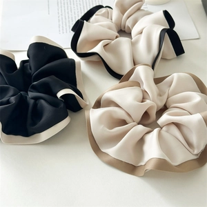 Three premium satin scrunchies with contrast piping edges in black, beige, and coffee