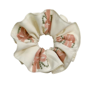 Off-white scrunchie with pink bow embroidery and green vine patterns for women