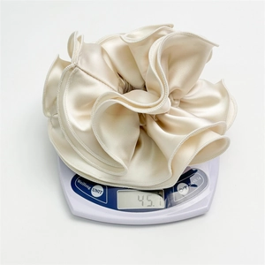 Luxurious large champagne satin scrunchie with ruffled edges, weighing 45g for premium quality