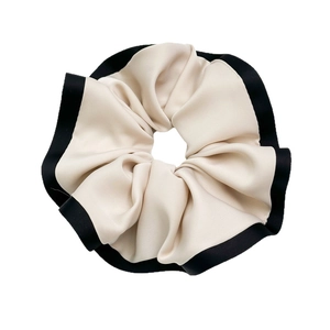 Elegant beige oversized scrunchie with black silk piping and ruffled satin fabric