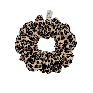 Classic leopard print scrunchie with high elasticity and premium texture on white background