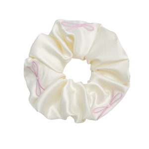Elegant cream satin scrunchie with pink embroidered bows for hair styling accessories