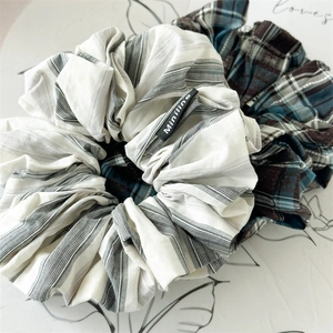 Handmade oversized plaid and striped fabric scrunchie set with woven label