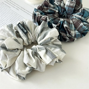 Oversized plaid and striped scrunchies set in blue and grey for chic hair styling