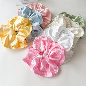 Oversized satin silk scrunchies in various macaron colors with elegant pleated ruffles