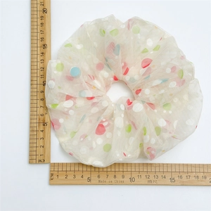Extra large 20cm mesh hair scrunchie with colorful polka dots on a white background