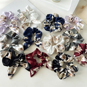 Floral satin scrunchies set with elegant bow design and silky finish in various colors