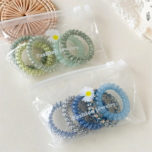 Élastiques à cheveux spirale type cordon de téléphone en pochette bijoux mode