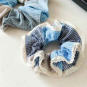 Oversized blue gingham scrunchie with lace trim edges and mixed patchwork patterns