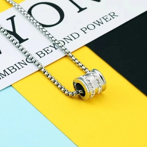 Polished silver cylinder pendant necklace with double row zircon inlays on a box chain