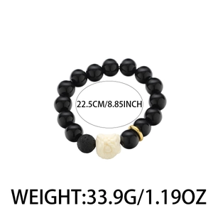 Obsidian beaded bracelet with lion pendant and volcanic stone on a white background