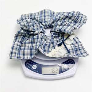 Blue plaid scrunchie with white lace edges and bow detail weighing 16.2g on scales