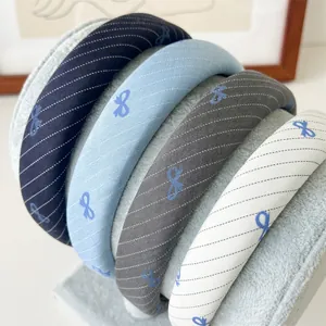 Blue fabric headband with diagonal stripes and bow prints, wide thick sponge hair hoop