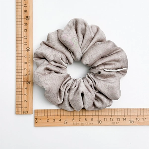 Grey textured fabric scrunchie with high elasticity for ponytails, 13.5cm diameter size