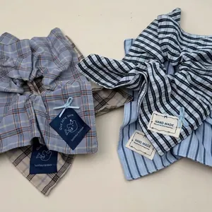 Plaid and striped fabric oversized bow scrunchies with handmade decorative labels