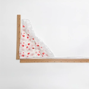 Detail view of lace strawberry triangle headscarf with size measurements in centimeters