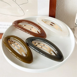 Elegante set van 4 ovale haarclips van hars in bruin, crème, groen en grijs