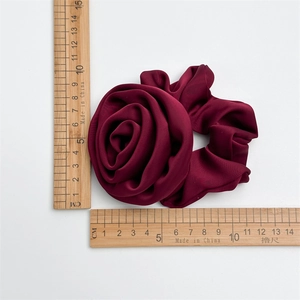 Elegant wine red satin rose flower scrunchie with 10cm diameter and fabric texture