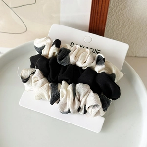 Set da tre elastici per capelli in nero pieno e motivi graffiti bianchi e neri