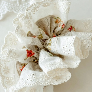 Floral scrunchie with white eyelet lace embroidery and French cottagecore aesthetic