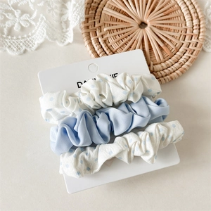 Three-piece hair scrunchie set with light blue solid color and white blue polka dots