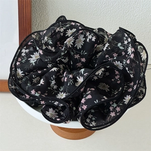 Elegant floral chiffon oversized hair scrunchie with daisy print on black fabric base