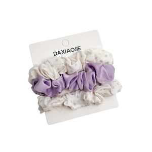 Three-piece hair scrunchie set in lavender satin and purple polka dot patterns with card