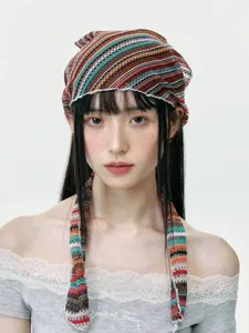 Close-up of colorful crochet knit headband with vintage striped pattern and ties