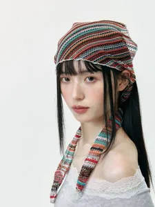 Close-up of knit hollow headscarf featuring vibrant striped patterns and long streamers
