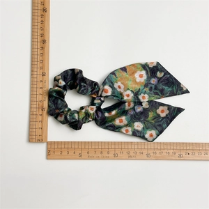 Detail view of Van Gogh ink oil painting style floral satin scrunchie with 17cm long ribbon