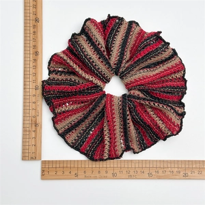 Detailed top view of a large striped knit hair tie measuring 14-15 cm on white background