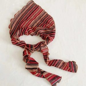 Striped knit head scarf with ruffled edges in multicolored bohemian stripes pattern