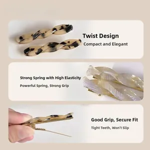 Detail view of acetate twisted hair clips with tortoise pattern and metal spring mechanism