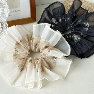 Floral print chiffon hair scrunchies with pleated ruffle edges in beige and black colors