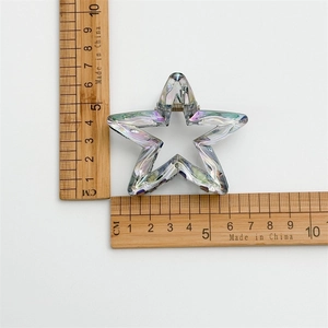 Holographic laser star hair claw clip for ponytail measurement on a white background