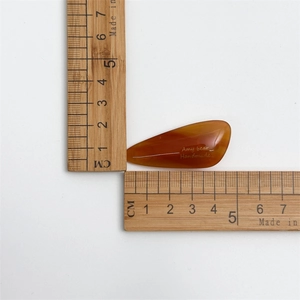 Set of 2 amber acetate teardrop hair clips with Amy Bear logo and 4.5cm size scale