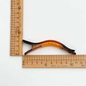 Amber brown jelly hair clip for women featuring a curved design and 11cm length