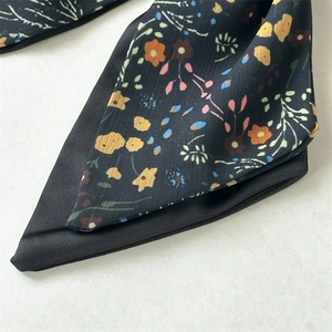 Detail view of the floral pattern on double-layer chiffon bow hair tie scrunchie