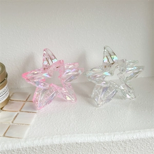 Detail of laser hollow star hair claws with iridescent coating and resin texture