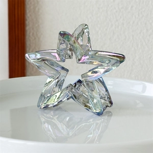 Macro shot of laser hollow star hair claw with iridescent holographic acrylic finish