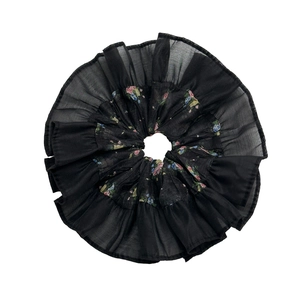Elegant floral patchwork scrunchie in black sheer fabric with ruffled edge