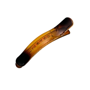 Large tortoiseshell resin hair clip with amber gradient and non-slip grip design