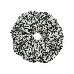 Elegant floral print scrunchie for women made of lightweight white and black cotton fabric