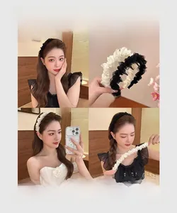 Detail of ballet style mesh headband with pearls for volume and head shape correction