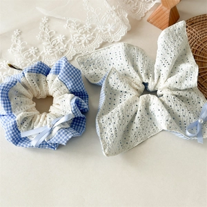 Blue plaid scrunchie with lace bow and pearl detail for women in minimalist style