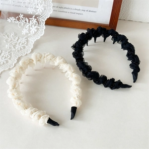 Detail of mesh pleated headbands with beads showing anti-slip hair comb teeth